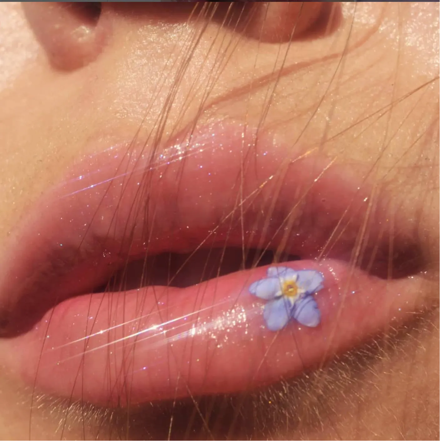 Glossy lips with flower detail